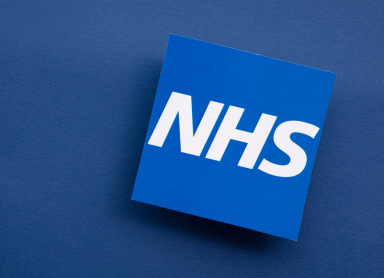 NHS logo on blue background